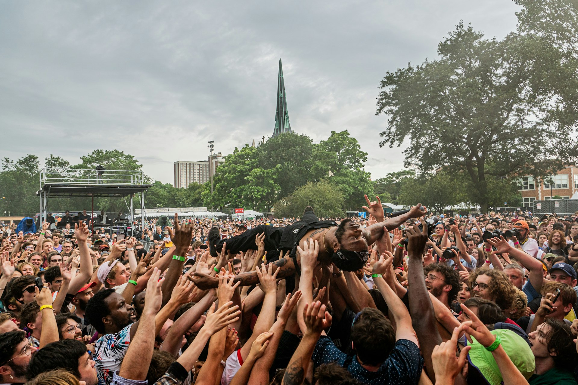 A man crowd surfs at the Pitchfork Music Festival. 